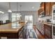 Bright kitchen with granite countertops, stainless steel appliances and a large center island at 6027 Kentworth Drive. Dr, Holly Springs, NC 27540