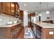 Charming kitchen featuring stainless steel appliances, granite countertops, and hardwood floors at 6027 Kentworth Drive. Dr, Holly Springs, NC 27540