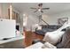 Comfortable living room with a gray sectional, hardwood floors and a fireplace at 6027 Kentworth Drive. Dr, Holly Springs, NC 27540