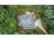 Aerial view of a home featuring a lush green yard, a paved driveway and back patio area at 603 Edburton Ct, Hillsborough, NC 27278