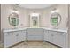 Bathroom featuring double sinks, vanity with white cabinets, and ample storage space at 603 Edburton Ct, Hillsborough, NC 27278