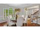 Elegant dining room with hardwood floors, and a statement light fixture at 603 Edburton Ct, Hillsborough, NC 27278