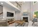 Open living room showcasing a fireplace, hardwood floors, and view of the home's second story at 603 Edburton Ct, Hillsborough, NC 27278