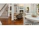 Spacious living room with stairs, fireplace, and a view of the dining area at 603 Edburton Ct, Hillsborough, NC 27278