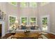 Inviting living room with a fireplace and multiple windows offering a picturesque outdoor view at 603 Edburton Ct, Hillsborough, NC 27278
