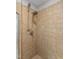 Walk-in shower featuring a dual shower head and beautiful neutral tile at 603 Edburton Ct, Hillsborough, NC 27278