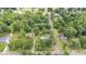 This house has mature trees and an awesome yard in an established neighborhood with beautiful surrounding greenery at 619 S Fifth St, Mebane, NC 27302