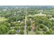 An aerial view showcasing a home's location within a neighborhood featuring tree-lined streets at 619 S Fifth St, Mebane, NC 27302