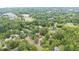 An aerial view of a charming home nestled among lush trees in a quiet neighborhood at 619 S Fifth St, Mebane, NC 27302