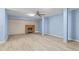 Finished basement with brick fireplace, light gray vinyl floors, and neutral decor at 619 S Fifth St, Mebane, NC 27302