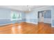 Traditional dining room featuring hardwood floors, chandelier, and large window at 619 S Fifth St, Mebane, NC 27302