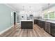 Beautiful kitchen featuring an island, stainless steel appliances, and modern cabinetry at 619 S Fifth St, Mebane, NC 27302