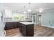 A kitchen with a center island and stainless steel appliances at 619 S Fifth St, Mebane, NC 27302