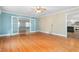 Open-concept living room with hardwood floors, French doors, and plenty of space at 619 S Fifth St, Mebane, NC 27302
