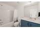 Full bathroom with a shower-tub combo, and blue vanity at 710 Vine Pkwy, Pittsboro, NC 27312