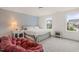 Comfortable bedroom with a light blue accent wall and plenty of natural light at 710 Vine Pkwy, Pittsboro, NC 27312