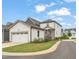 Charming home featuring a two-car garage, covered porch, and well-manicured front lawn at 710 Vine Pkwy, Pittsboro, NC 27312