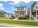 Attractive two-story home featuring a cozy front porch and manicured front lawn at 710 Vine Pkwy, Pittsboro, NC 27312