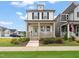Charming two-story home with a welcoming front porch and a well-maintained lawn at 710 Vine Pkwy, Pittsboro, NC 27312