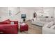 Open concept living area with comfortable seating and a view of the staircase at 710 Vine Pkwy, Pittsboro, NC 27312