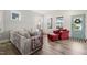 Bright living room featuring modern decor, hardwood floors, and lots of natural light at 710 Vine Pkwy, Pittsboro, NC 27312