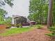 Enjoy the enclosed porch and deck overlooking a beautiful, treelined backyard at 7501 Montibillo Pkwy, Durham, NC 27713