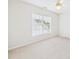 Carpeted bedroom featuring natural light from the window and a ceiling fan at 7501 Montibillo Pkwy, Durham, NC 27713