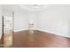 Spacious primary bedroom boasts hardwood floors, white trim, and bright, natural light at 7501 Montibillo Pkwy, Durham, NC 27713