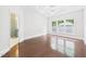 Large bedroom features hardwood floors, white trim, and plenty of natural light at 7501 Montibillo Pkwy, Durham, NC 27713
