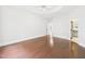 Primary bedroom boasts hardwood floors, neutral walls, white trim, and ensuite bath at 7501 Montibillo Pkwy, Durham, NC 27713