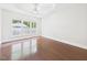 Large bedroom features hardwood floors, white trim, and plenty of natural light at 7501 Montibillo Pkwy, Durham, NC 27713