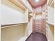 Spacious walk-in closet featuring custom wood shelving and ample storage space at 7501 Montibillo Pkwy, Durham, NC 27713