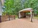 Expansive deck featuring a gazebo, ideal for outdoor entertaining and relaxation in a private backyard at 7501 Montibillo Pkwy, Durham, NC 27713
