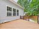 Spacious deck with railing, offering an outdoor relaxation area with backyard access at 7501 Montibillo Pkwy, Durham, NC 27713