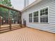 Deck with a screened-in porch providing views of the spacious backyard at 7501 Montibillo Pkwy, Durham, NC 27713