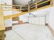 Spacious two-car garage with high ceilings and natural light from the open garage door at 7501 Montibillo Pkwy, Durham, NC 27713