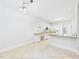 Kitchen featuring granite counters, white appliances, a breakfast bar, and a desk area at 7501 Montibillo Pkwy, Durham, NC 27713