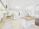 Bright kitchen features granite counters, white cabinets, island, and tile flooring at 7501 Montibillo Pkwy, Durham, NC 27713
