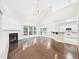 Bright, airy living room with hardwood floors, a fireplace, and an open layout at 7501 Montibillo Pkwy, Durham, NC 27713