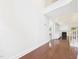 Spacious living room showing open floor plan with hardwood floors and fireplace at 7501 Montibillo Pkwy, Durham, NC 27713
