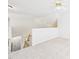 Open loft area with neutral carpet, ceiling fan, and natural light at 7501 Montibillo Pkwy, Durham, NC 27713