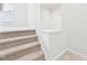Carpeted staircase with white walls and recessed lighting at 7501 Montibillo Pkwy, Durham, NC 27713