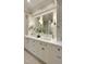 Bright bathroom with double vanities, marble countertop, and classic fixtures at 800 Lakestone Dr, Raleigh, NC 27609