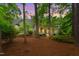 Charming home with inviting front porch and lush, mature landscaping creating a serene, wooded setting at 800 Lakestone Dr, Raleigh, NC 27609
