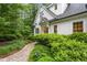 Charming home exterior with lush landscaping, brick walkway, and inviting entrance at 800 Lakestone Dr, Raleigh, NC 27609