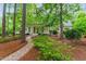 Beautiful home featuring a classic front porch, manicured landscaping, and a welcoming walkway at 800 Lakestone Dr, Raleigh, NC 27609