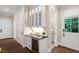 Hallway with built-in bar and wine cooler at 800 Lakestone Dr, Raleigh, NC 27609