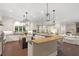 Bright kitchen with stainless steel appliances, pendant lighting, and easy access to the living room at 800 Lakestone Dr, Raleigh, NC 27609