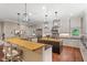 Spacious kitchen featuring ample counter space, modern stainless steel appliances, and custom cabinetry at 800 Lakestone Dr, Raleigh, NC 27609