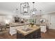 Open kitchen with large island, stainless steel sink, and an inviting flow to the living area at 800 Lakestone Dr, Raleigh, NC 27609